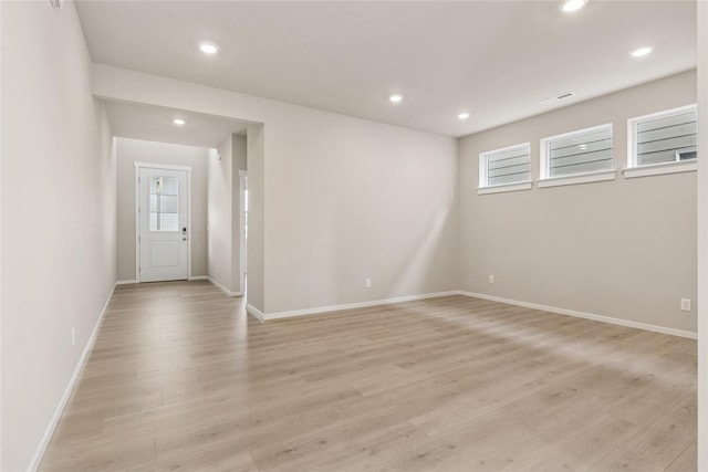 interior space featuring recessed lighting, baseboards, visible vents, and light wood-type flooring