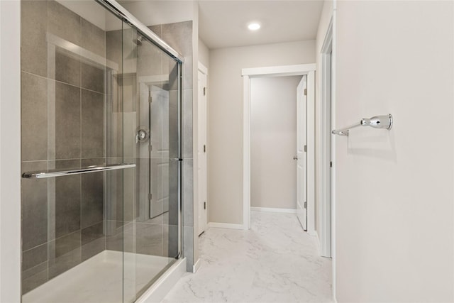 full bath featuring baseboards, a stall shower, recessed lighting, and marble finish floor