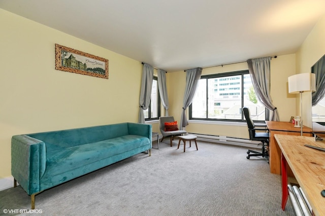 interior space featuring carpet flooring and a baseboard heating unit