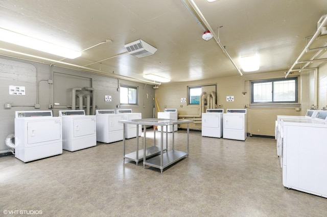 community laundry room with separate washer and dryer