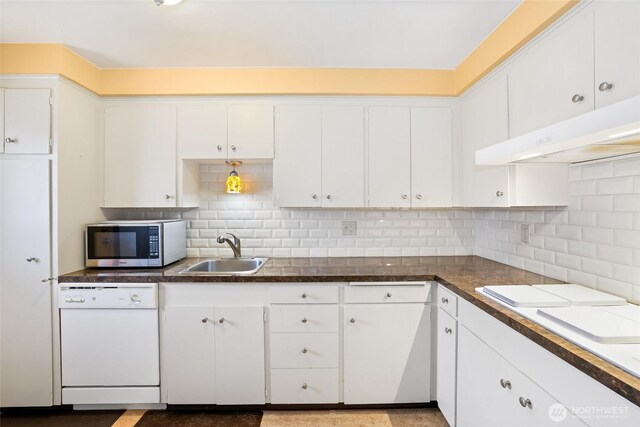 kitchen featuring white cabinets, a sink, dishwasher, stainless steel microwave, and under cabinet range hood