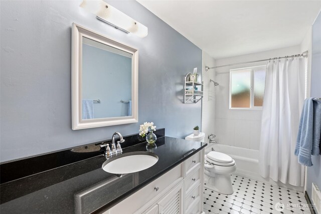 bathroom with toilet, tile patterned floors, shower / tub combo, and vanity