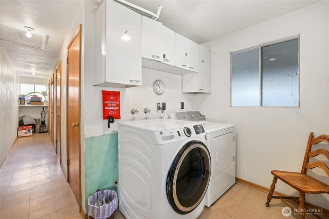 laundry room with cabinet space, independent washer and dryer, baseboards, and light floors