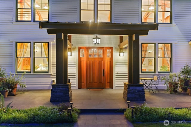 doorway to property featuring covered porch