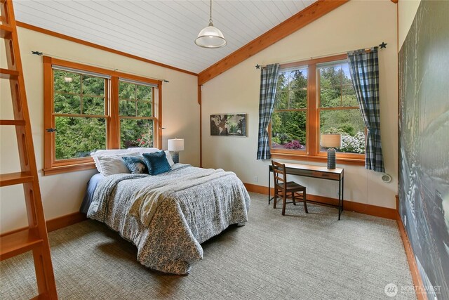 carpeted bedroom featuring baseboards, wooden ceiling, and vaulted ceiling with beams