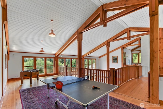 rec room with vaulted ceiling with beams and hardwood / wood-style floors