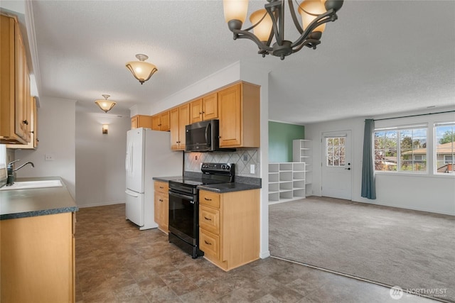 kitchen with freestanding refrigerator, dark countertops, a textured ceiling, black electric range, and a sink