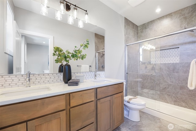 26628 NE 143rd Pl, Duvall, WA 98019 - bathroom with toilet, tasteful backsplash, a stall shower, and a sink