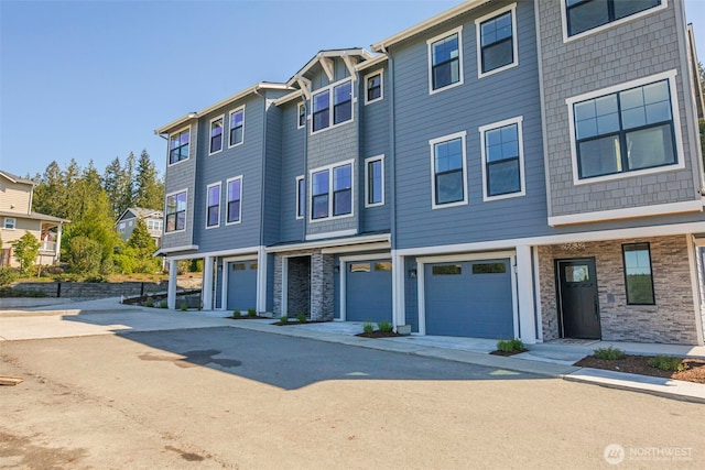 26632 NE 143rd Pl, Duvall, WA 98019 - multi unit property with a garage, driveway, stone siding, and a residential view