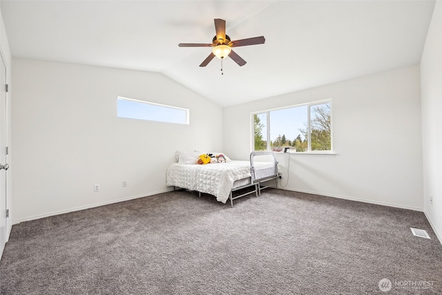 bedroom featuring carpet floors, a ceiling fan, baseboards, lofted ceiling, and visible vents