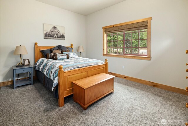 carpeted bedroom with baseboards