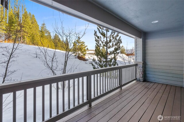 view of snow covered deck