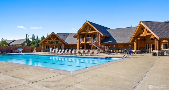 pool featuring a patio and fence