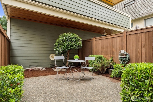 view of patio / terrace featuring fence and outdoor dining space