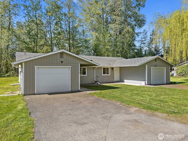 single story home featuring roof with shingles and a front lawn