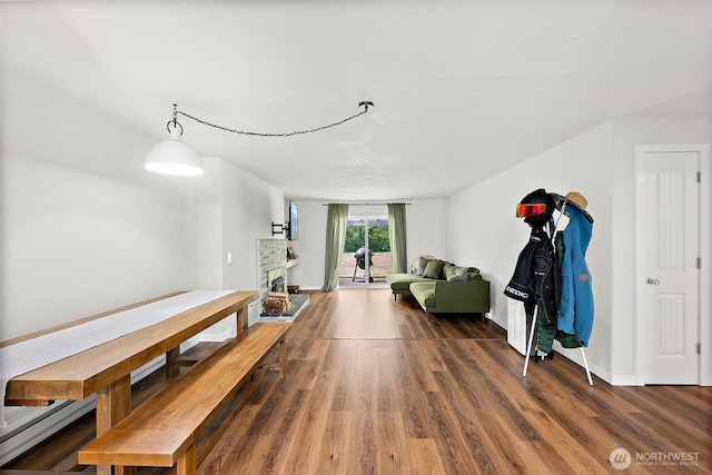 dining area featuring baseboards and wood finished floors