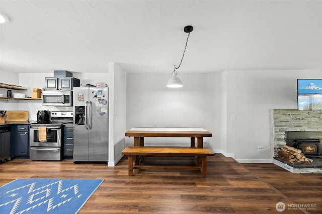 dining room with baseboards and dark wood-style floors