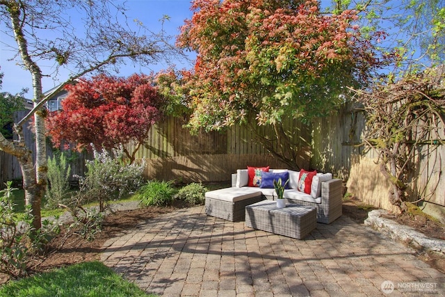 view of patio / terrace with a fenced backyard and an outdoor living space