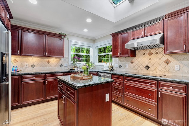 1823 Richards Rd, Bellevue, WA 98005 - kitchen with under cabinet range hood, light wood-type flooring, and reddish brown cabinets