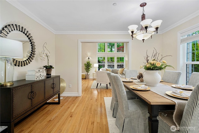 1823 Richards Rd, Bellevue, WA 98005 - dining area with crown molding, light wood-style flooring, baseboards, and a chandelier