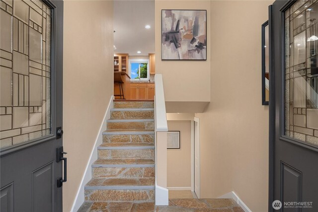 foyer with stairs, recessed lighting, and baseboards