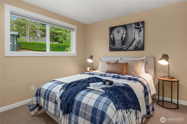 carpeted bedroom with baseboards