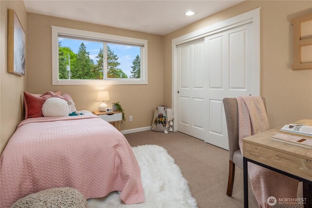 carpeted bedroom with baseboards, a closet, and recessed lighting