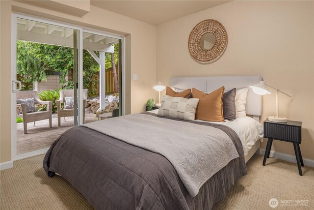 bedroom with carpet flooring, baseboards, and access to exterior