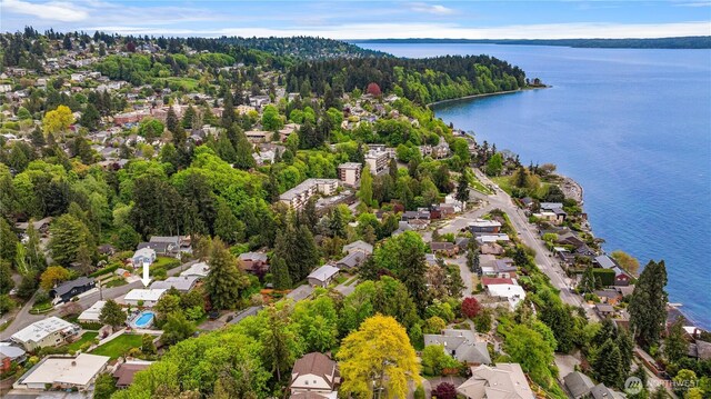 aerial view featuring a water view, a residential view, and a forest view