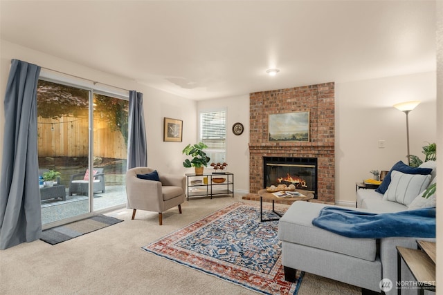 carpeted living room featuring a fireplace