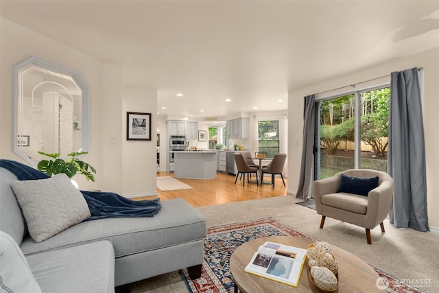 living room featuring recessed lighting and light wood-type flooring