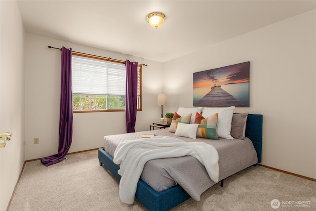 bedroom with carpet flooring and baseboards