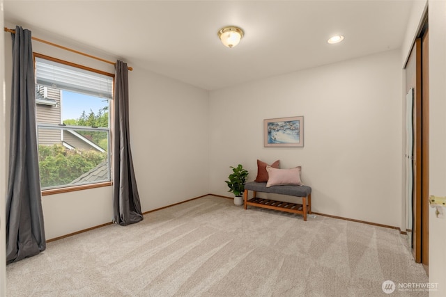 sitting room featuring carpet floors, recessed lighting, and baseboards