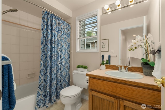 bathroom with vanity, toilet, and shower / tub combo with curtain