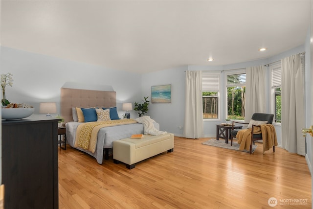 bedroom with recessed lighting, baseboards, and light wood finished floors