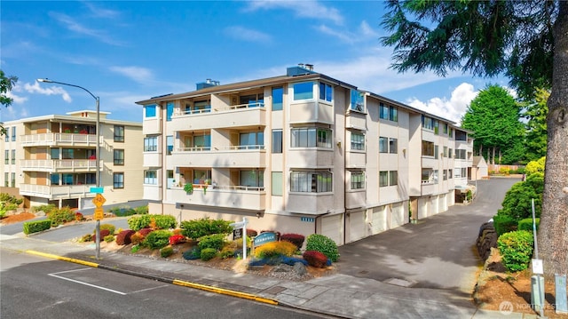1113 5th Ave S Unit 301, Edmonds, WA 98020 - view of apartment building / complex with driveway and an attached garage