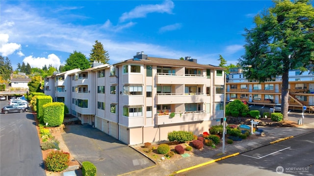 1113 5th Ave S Unit 301, Edmonds, WA 98020 - view of apartment building / complex featuring a garage