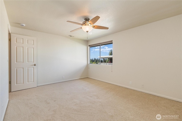 1113 5th Ave S Unit 301, Edmonds, WA 98020 - carpeted empty room featuring a ceiling fan, baseboards, and a smoke detector