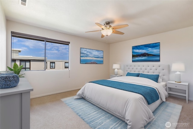 1113 5th Ave S Unit 301, Edmonds, WA 98020 - bedroom with light carpet, baseboards, and ceiling fan
