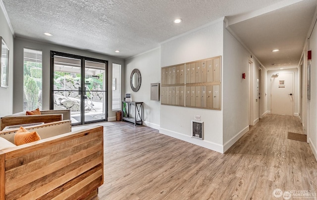 1113 5th Ave S Unit 301, Edmonds, WA 98020 - foyer featuring mail area, light wood finished floors, a textured ceiling, baseboards, and recessed lighting