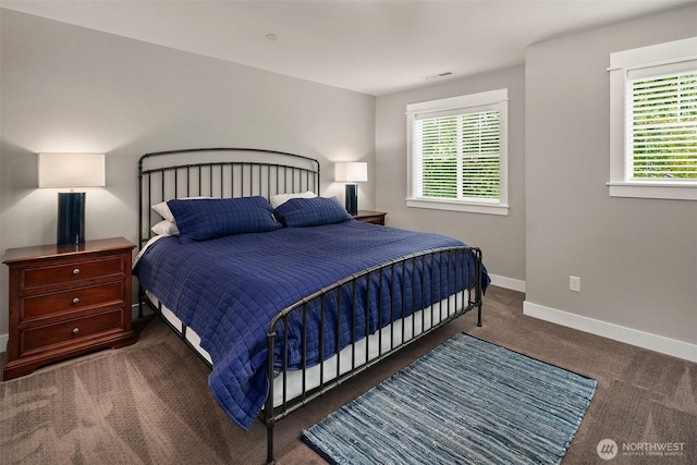 carpeted bedroom with baseboards and visible vents