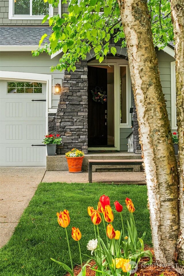 doorway to property with stone siding