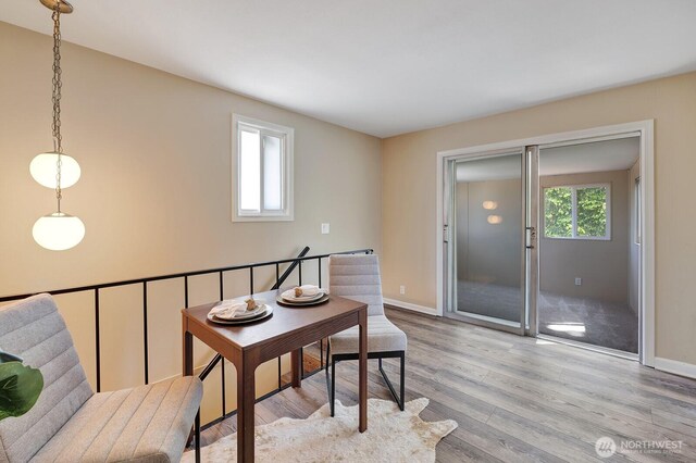 home office featuring light wood-style flooring and baseboards