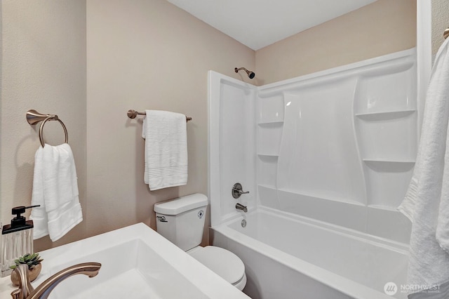 full bathroom featuring toilet and tub / shower combination