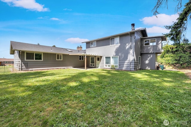 rear view of property featuring a patio