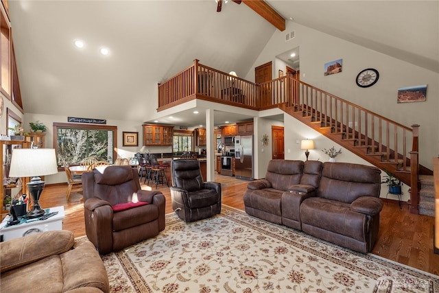 81 N Fawn Dr, Hoodsport, WA 98548 - living area featuring beamed ceiling, high vaulted ceiling, stairway, and light wood-style floors