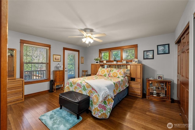 81 N Fawn Dr, Hoodsport, WA 98548 - bedroom featuring access to exterior, a ceiling fan, baseboards, wood finished floors, and a closet