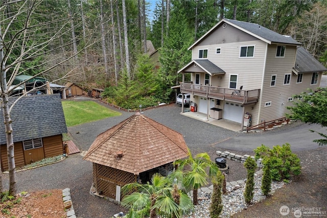 81 N Fawn Dr, Hoodsport, WA 98548 - exterior space with a garage and a shingled roof