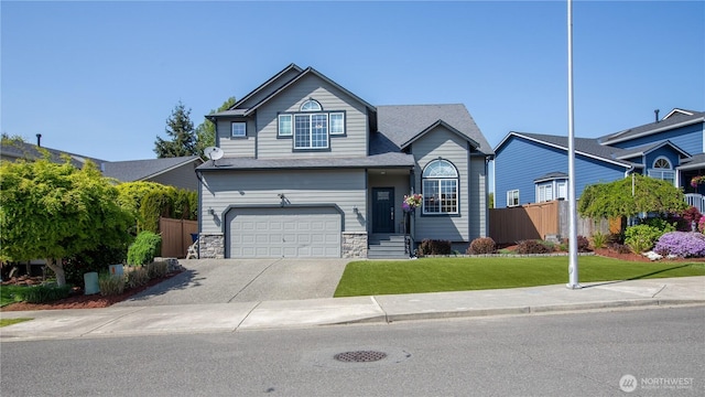 11234 SE 299th Pl, Auburn, WA 98092 - view of front facade featuring fence, an attached garage, stone siding, driveway, and a front lawn