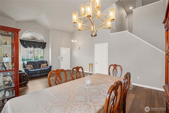 11234 SE 299th Pl, Auburn, WA 98092 - dining space featuring an inviting chandelier, dark wood finished floors, stairs, and high vaulted ceiling